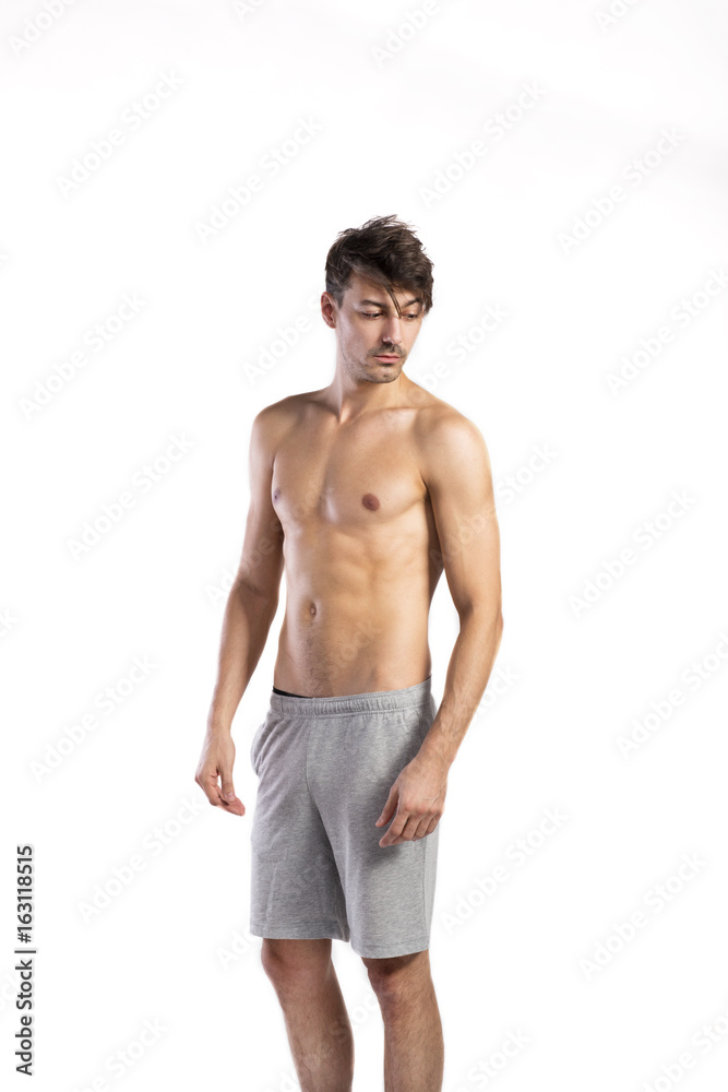 Shirtless fitness man. Studio shot. White background. Shirtless fitness man. Studio shot. White background.