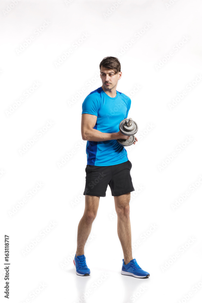 Fitness man holding dumbbell, working out, studio shot. Fitness man holding dumbbell, working out, studio shot.