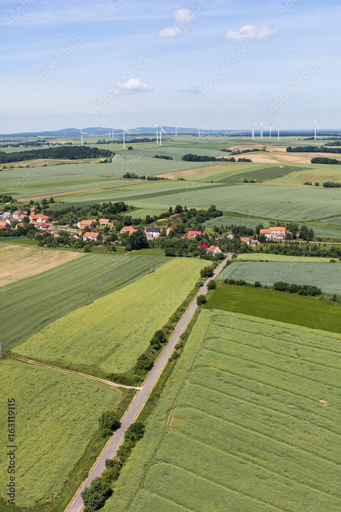 Fototapeta premium aerial view of the Lasowice village and harvest fields