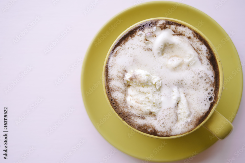 Ice cream and coffee in yellow cup Ice cream and coffee in yellow cup