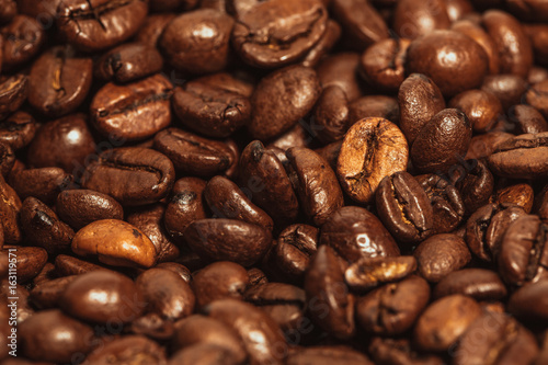 Dark many roasted coffee beans texture background photo