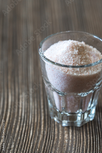 Glass of pink sea salt