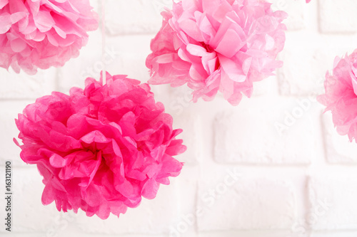 Paper flowers at the girl baby shower party.  Baby shower celebration concept