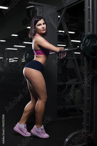 Young sexy girl posing in gym.