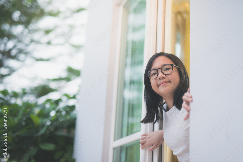 Asian girl look out the window