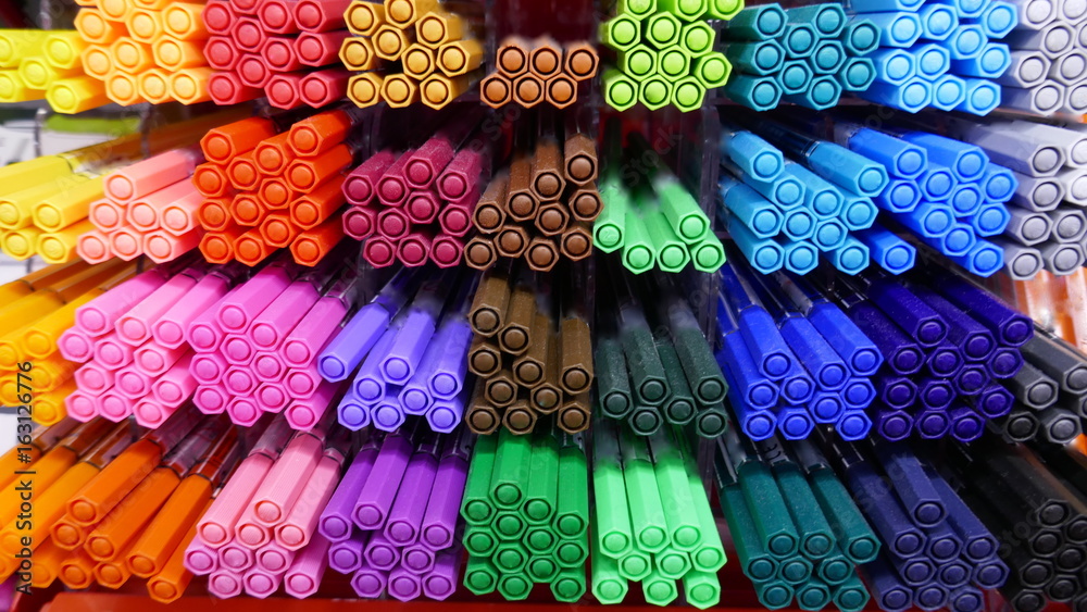 Viele farbige Stifte in einem Regal Stock Photo | Adobe Stock
