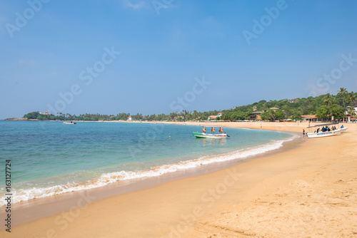 Fototapeta Naklejka Na Ścianę i Meble -  At the beach of Unawatuna, one of the major tourist spots in the south west of Sri Lanka