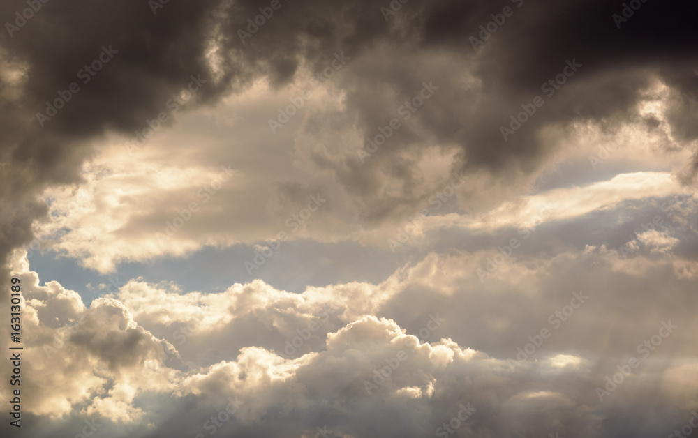 Fototapeta premium a big and fluffy cumulonimbus cloud in the blue sky