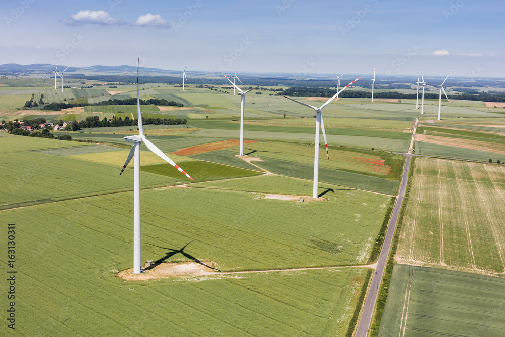 Obraz premium aerial view of the wind farm and harvest fields