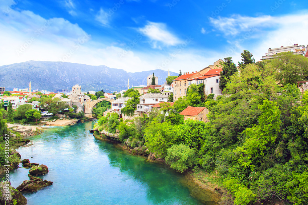 Beautiful view Old bridge in Mostar on the Neretva river, Bosnia and Herzegovina, on a sunny day Beautiful view Old bridge in Mostar on the Neretva river, Bosnia and Herzegovina, on a sunny day