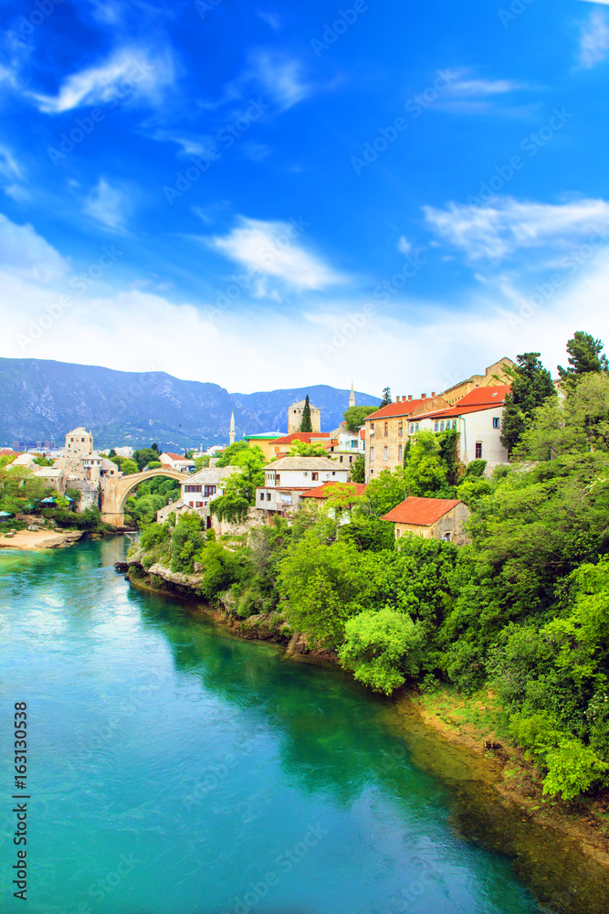Beautiful view Old bridge in Mostar on the Neretva river, Bosnia and Herzegovina, on a sunny day