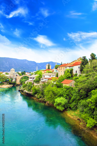 Beautiful view Old bridge in Mostar on the Neretva river, Bosnia and Herzegovina, on a sunny day © marinadatsenko