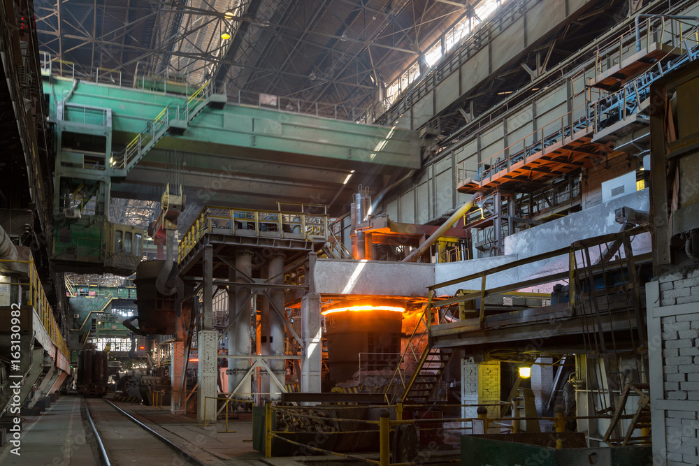 Smelting steels in heavy industry factory.