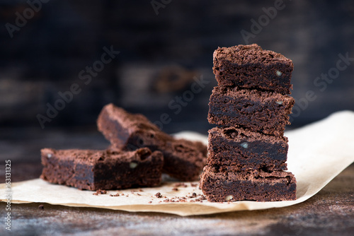 Chocolate brownie cake on brown baking paper photo
