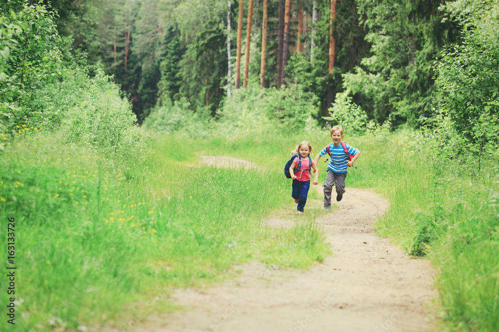 happy little boy and girl run to school happy little boy and girl run to school