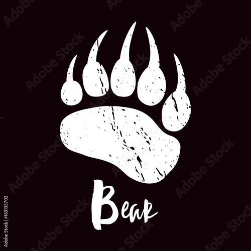 A trace a bear. White silhouette of paw on a black background. Vector. The imprint of a bear s foot. Logo of the footprint.