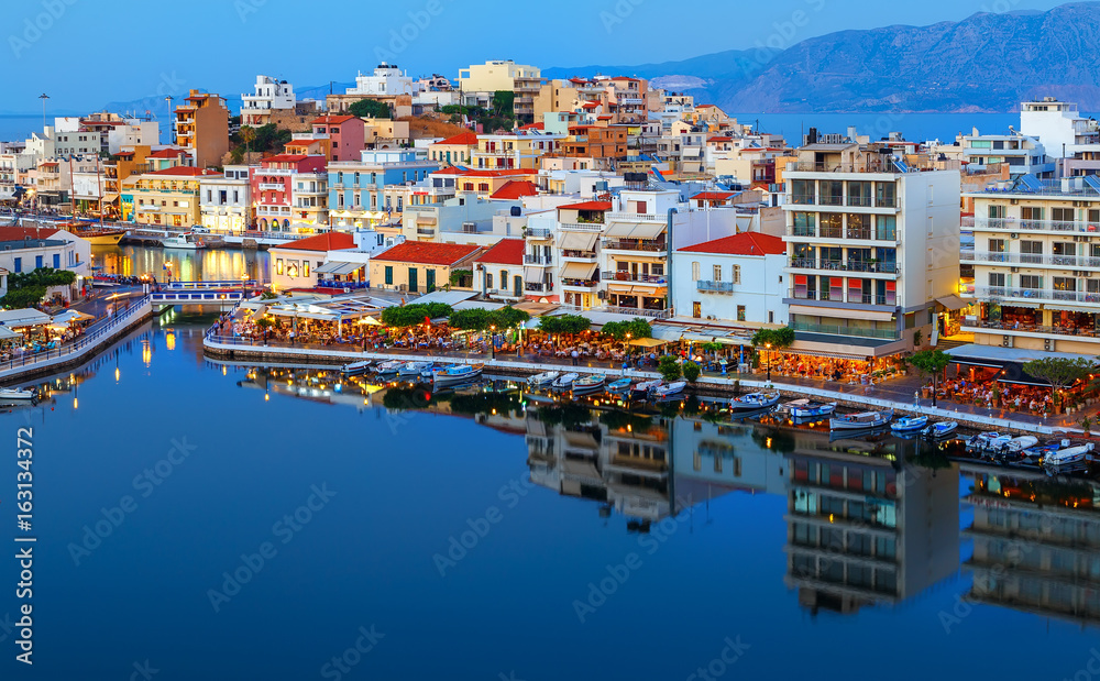 Agios Nikolaos at night. Crete, Greece. Agios Nikolaos is a picturesque town in the eastern part of the island Crete built on the northwest side of peaceful bay of Mirabello.