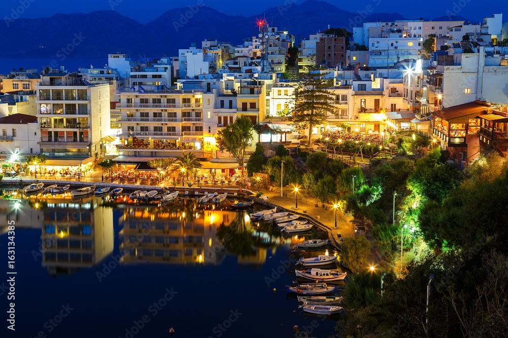 Agios Nikolaos City and Voulismeni Lake at Night Crete, Greece Agios Nikolaos City and Voulismeni Lake at Night Crete, Greece