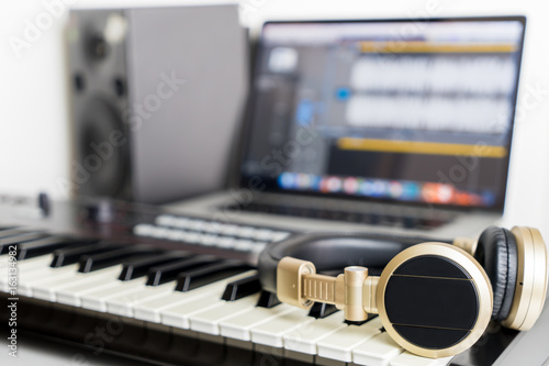 Home Music computer studio with golden headphone
