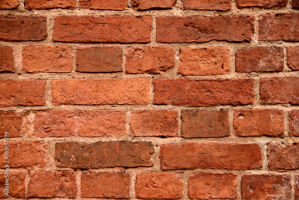 Fototapeta premium Old red brick wall background. Ancient brick texture.