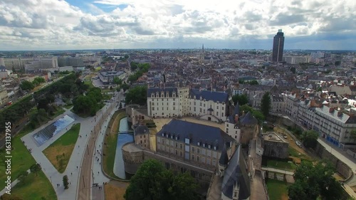 Aerial view of cityscape of Nantes, fort Chateau de Nantes, famous Cathedral of St. Peter and St. Paul in background - Normandy, France, 4k UHD   photo