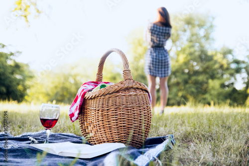 Picnic basket and woman in background