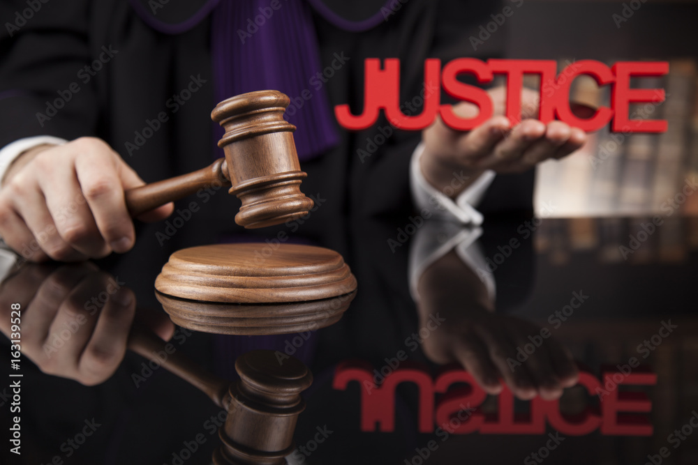 Justice and law concept. Male judge in a courtroom