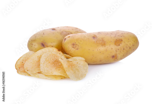 potato chips and raw potato on white background