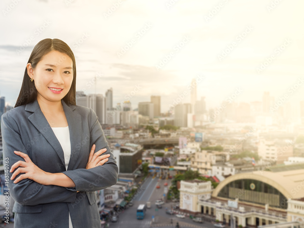 Young businesswomen with blurred cityscape background Young businesswomen with blurred cityscape background
