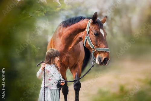 Girl with her horse outdoor portrait 