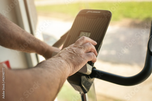 Close up of senior man on the treadmill.