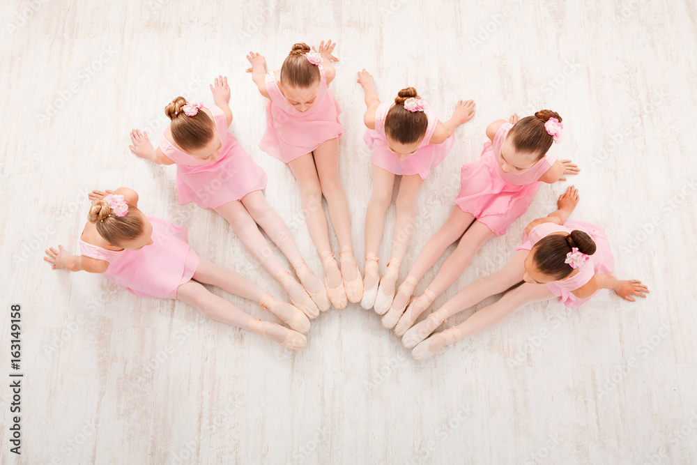 Fototapeta premium Little girls dancing ballet in studio