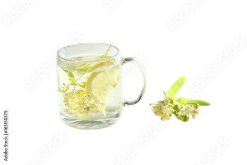 Lime tea with lemon in a glass cup