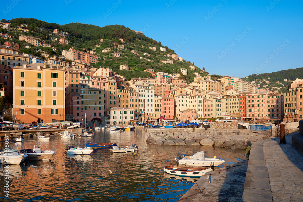 Camogli typical village with colorful houses and small harbor bay in Italy, Liguria in a sunny day