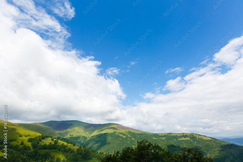 Summer landscape in mountains and the dark blue sky with clouds Summer landscape in mountains and the dark blue sky with clouds