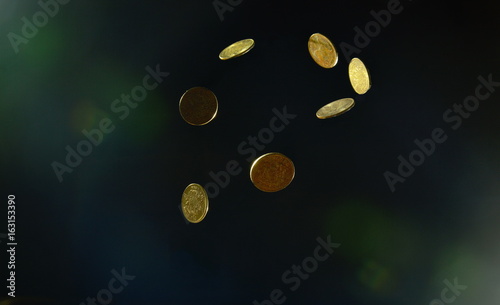 coin floating with currency fluctuations on black background 