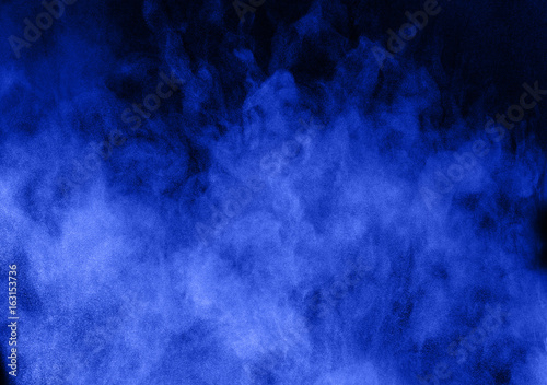 abstract color powder splatted on black background,Freeze motion of color powder exploding.