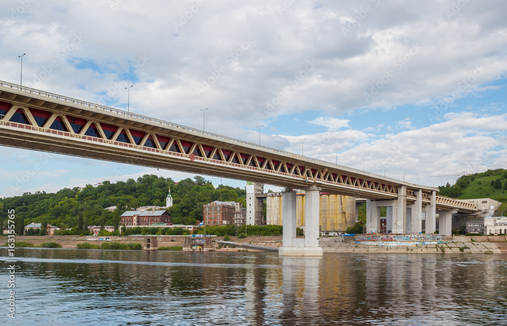 Metro bridge across the Oka in Nizhny Novgorod in the summer with reflection