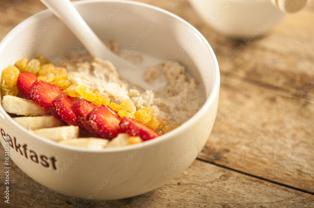 oatmeal porridge with strawberry and banana in a bowl oatmeal porridge with strawberry and banana in a bowl