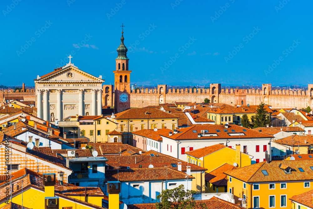 Italian city skyline. Walled town of Cittadella. Cityscape of the Medieval fortress-town. Text in Latin: 