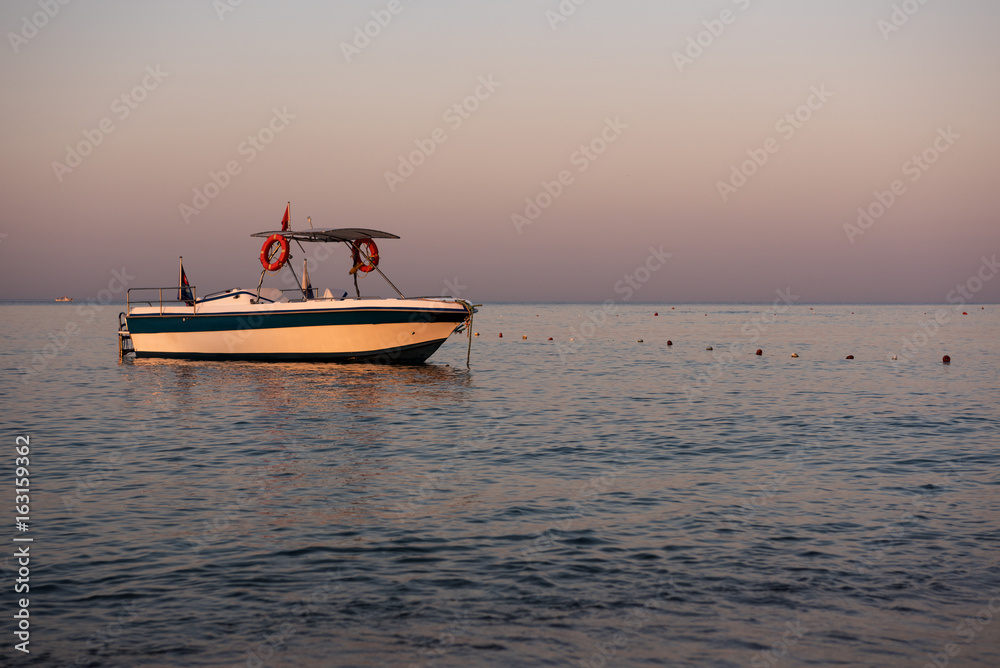 Boat on Mediterranean sea at dawn. Boat on Mediterranean sea at dawn.
