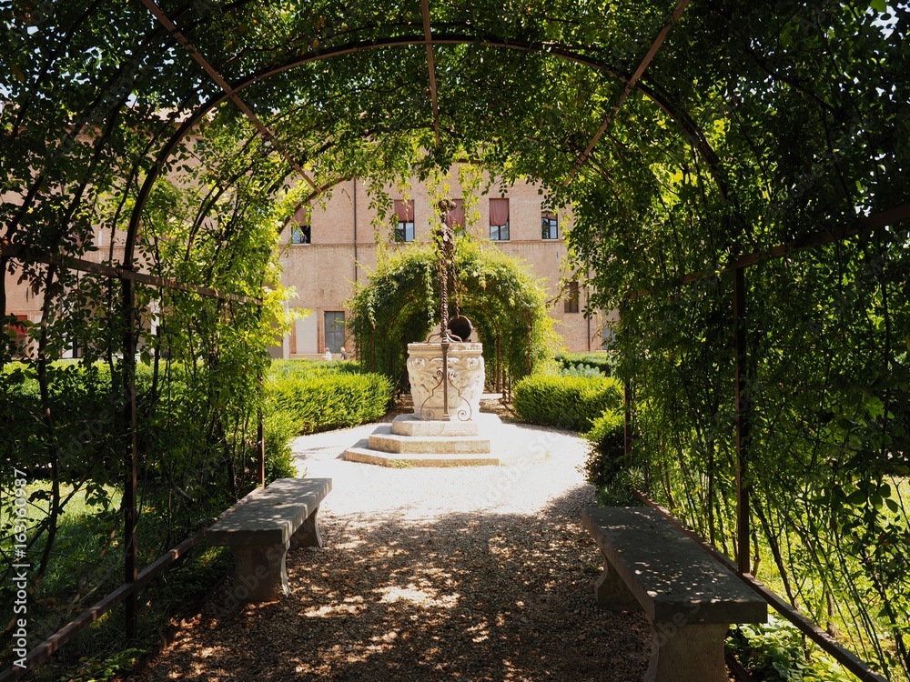 Pergola and well, Costabili Palace, Ferrara, Italy