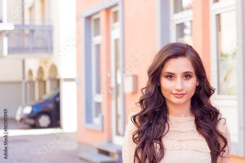 Young beautiful woman brunette walks at the city in Europe. Summer. Happy girl. Street fashion. Free Download Young beautiful woman brunette walks at the city in Europe. Summer. Happy girl. Street fashion. - GFXLoad