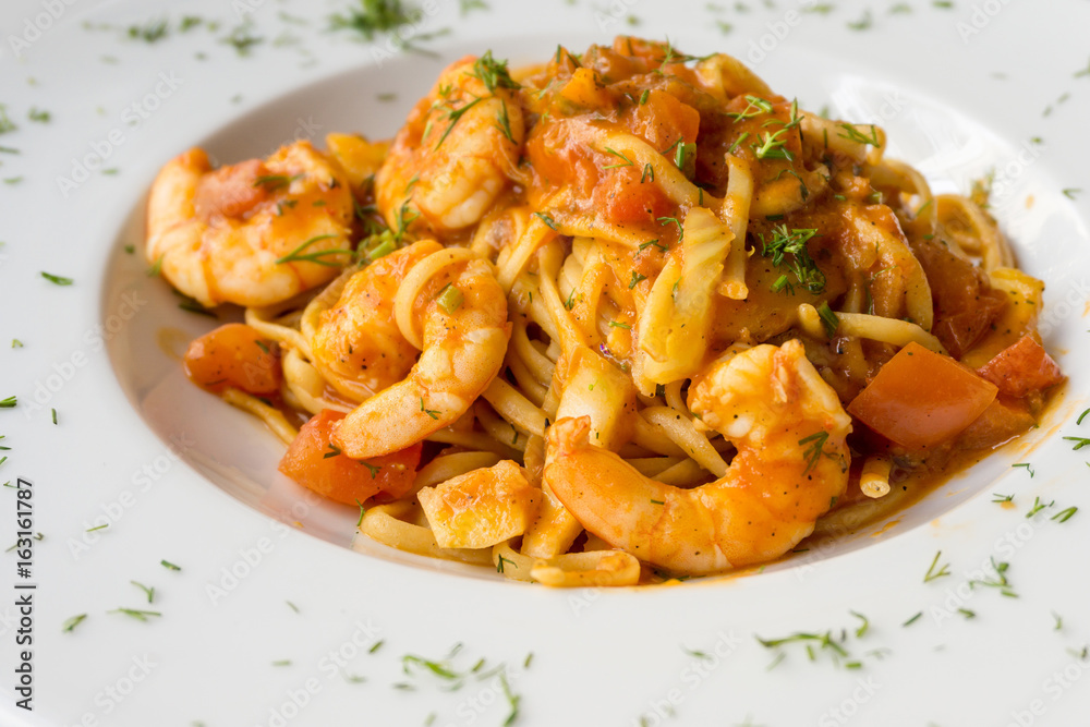 close-up of plate of pasta and Shrimp with lettuce close-up of plate of pasta and Shrimp with lettuce