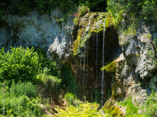 Mountain stream waterfall. Bigar mountain waterfall, Romania photo