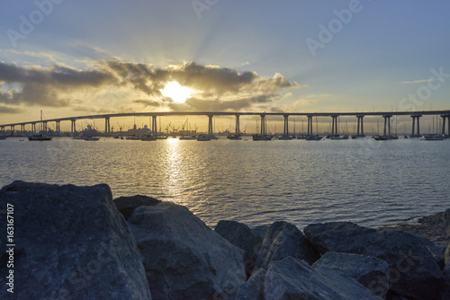 Brilliant sun coming up over the Coronado Bridge, San Diego California