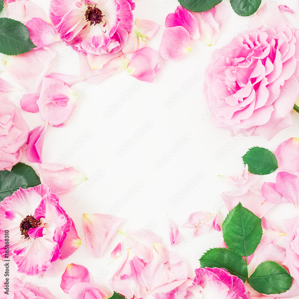 Pink rose flowers, leaves and petals on white background. Flat lay, top view. Round floral frame