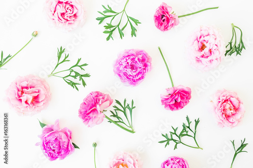 Summer floral composition of peony flowers  roses and leaves on white background. Flat lay  top view.