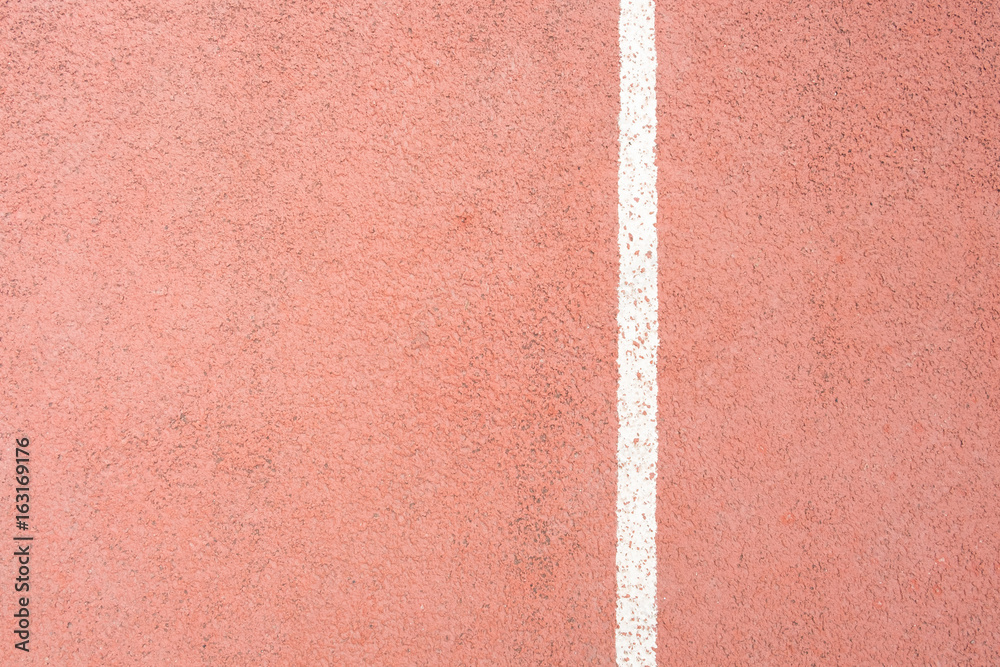 surface of the red running track in the stadium on top view for copy space emtry background.