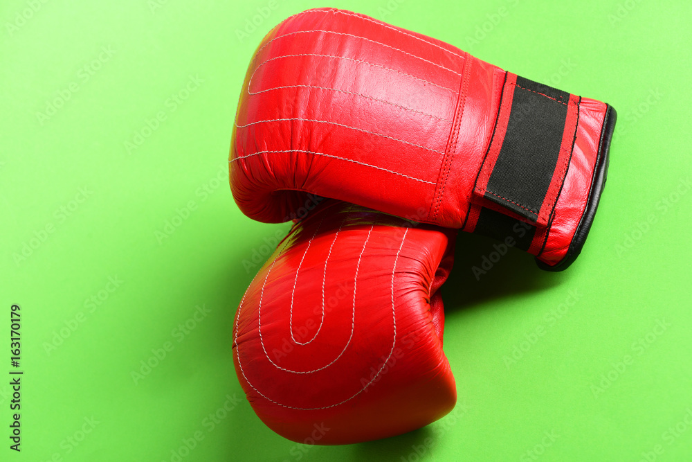 Boxing gloves in red color. Training and fitness concept